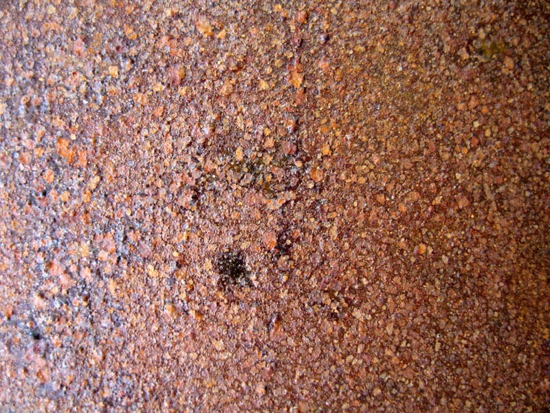What Results in the development of Patina in Copper?